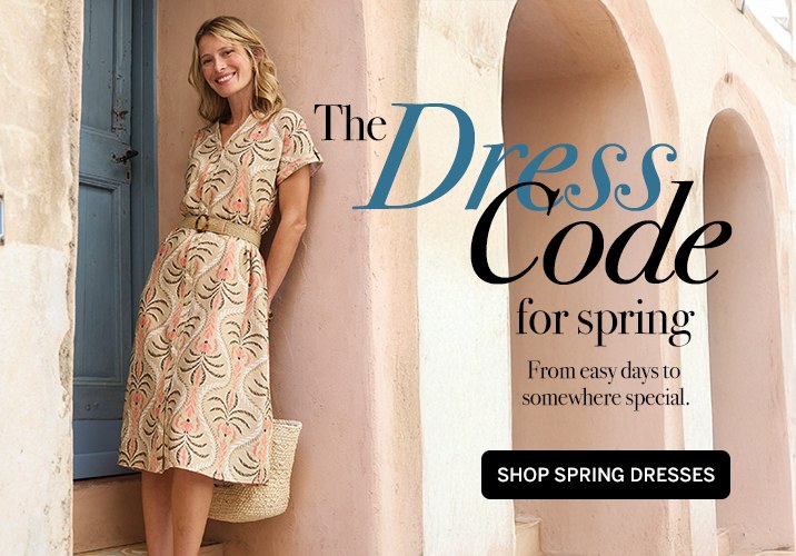 Web banner: The Dress Code for spring, with a woman in a printed dress and a Shop Spring Dresses button